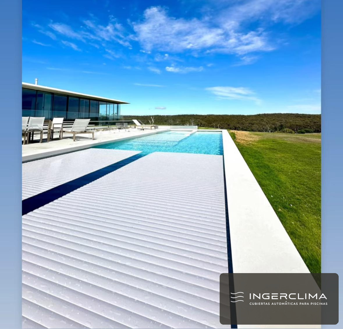 White slatted cover rolling back over an infinity pool