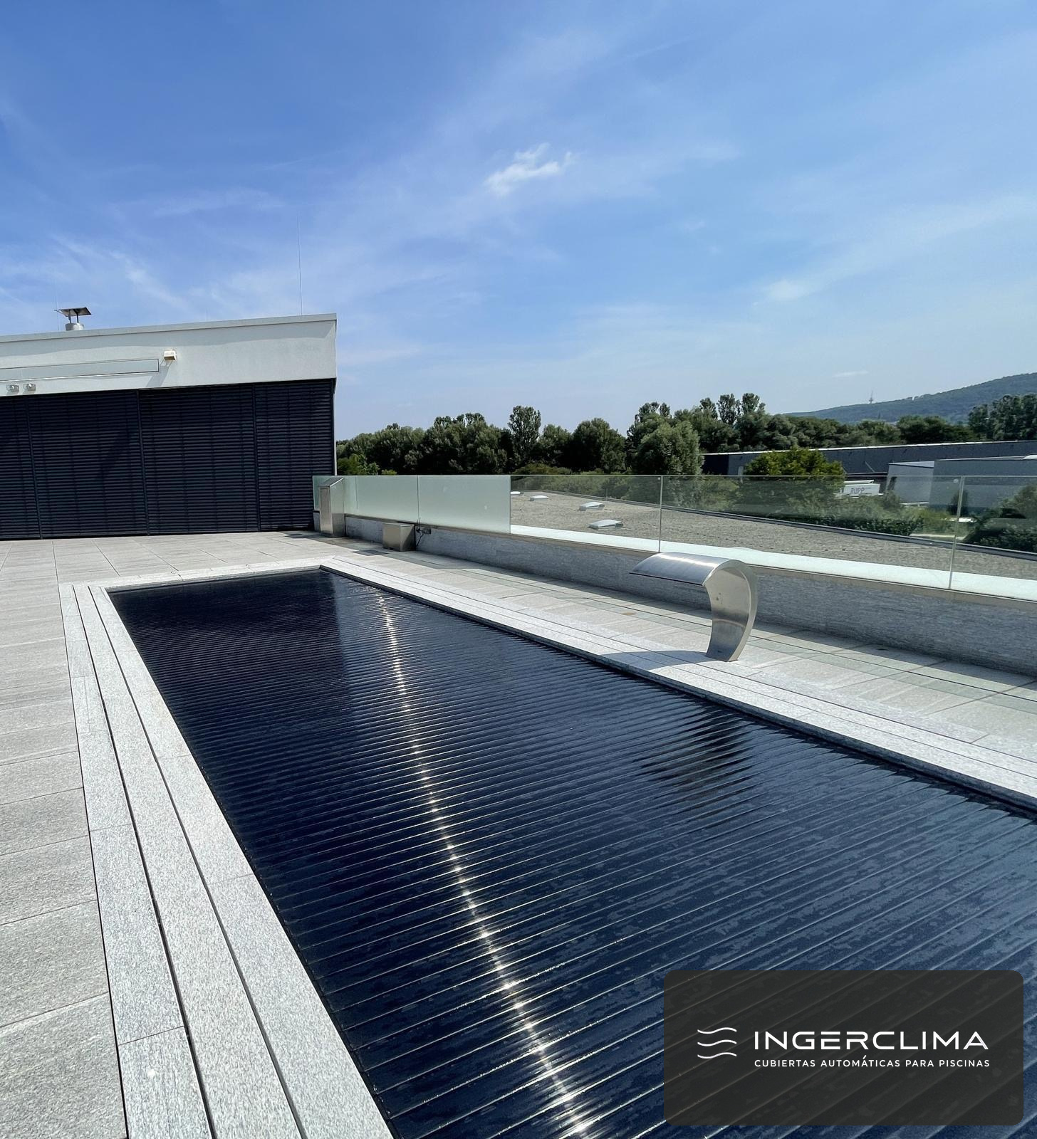 Dark blue slatted cover closed in front of a modern house