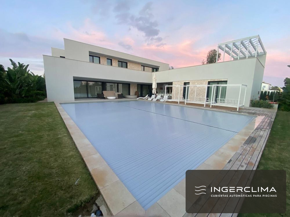 Automatic pool cover installation with golf-course views